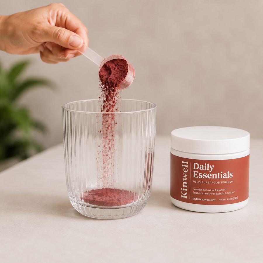 Take one scoop of Kinwell Daily Essentials, and pour into an empty glass.